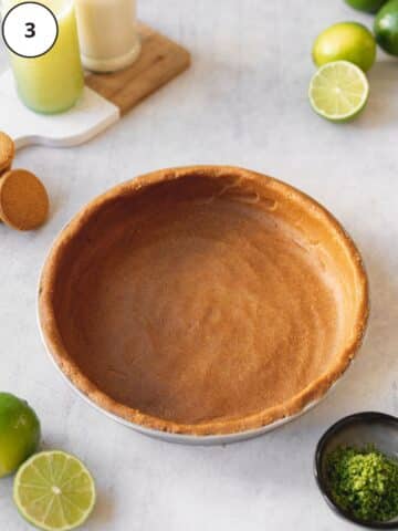 a large pie dish with no-bake ginger cookie crust neatly pressed into the base and sides.