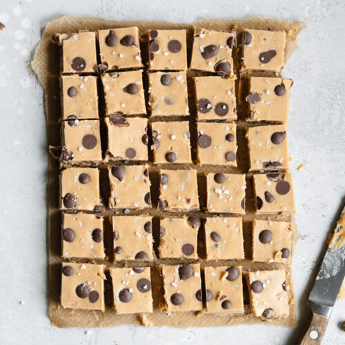 flatlay of cookie dough fudge on grey surface.