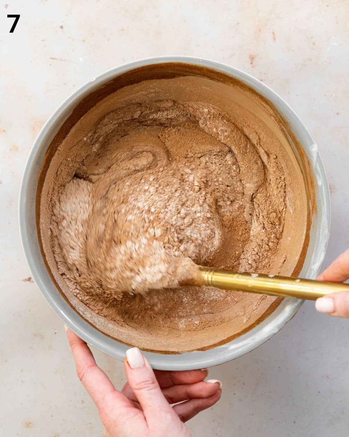 folding flour into brownie batter.
