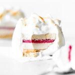 single serve baked alaska with centre cut and raspberry jelly centre.