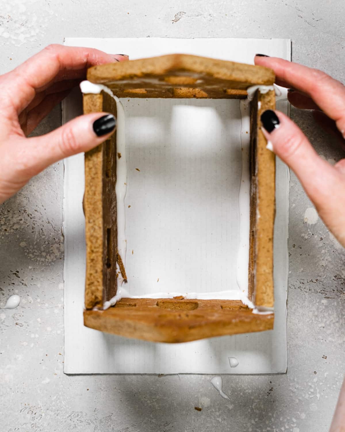 assembling a gingerbread house.