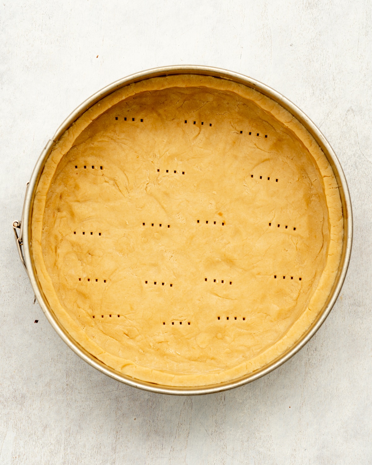 shortcrust pastry in a round cake tin.
