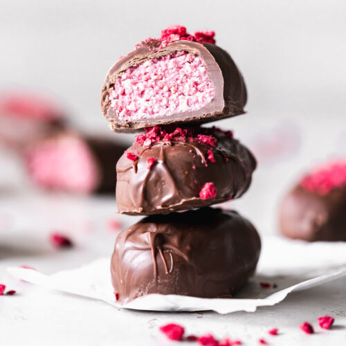 stack of bounty chocolate bars with pink raspberry filling.