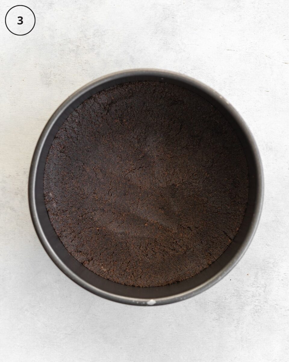 top down view of cookie crust in a cake pan.