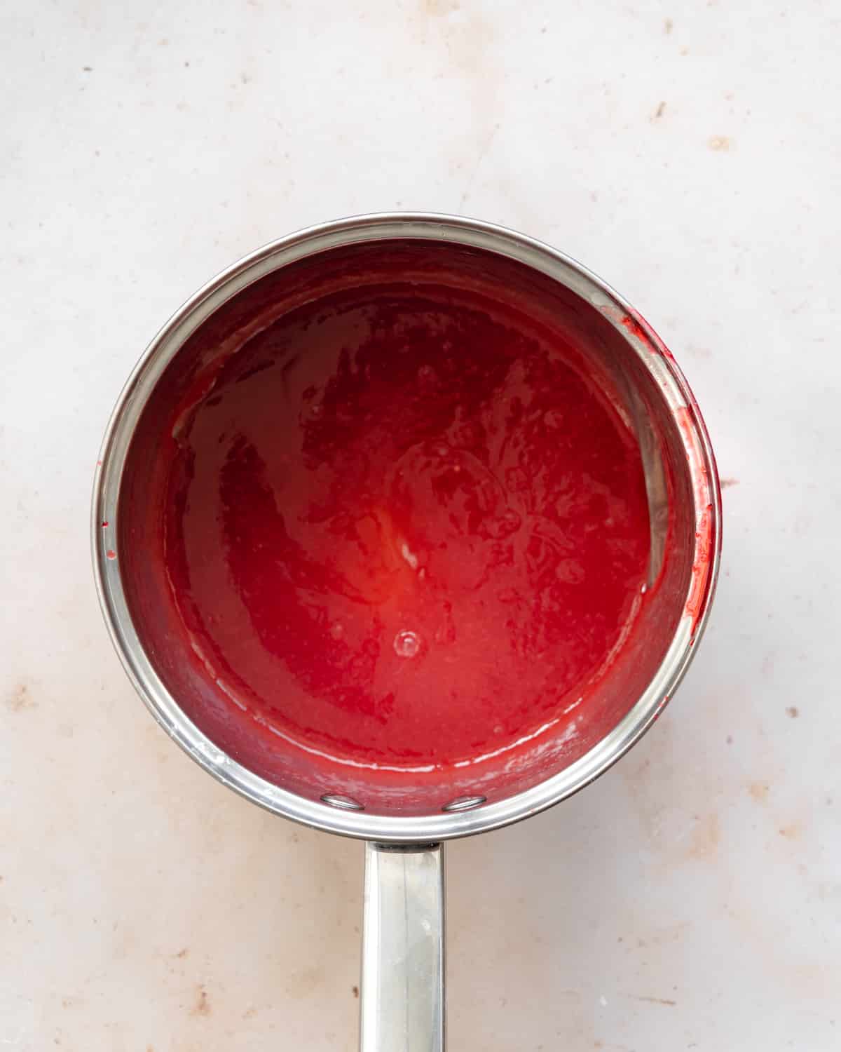 raspberry glaze in a saucepan.