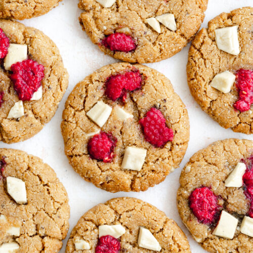 flatylay of white chocolate raspberry cookies lined up.