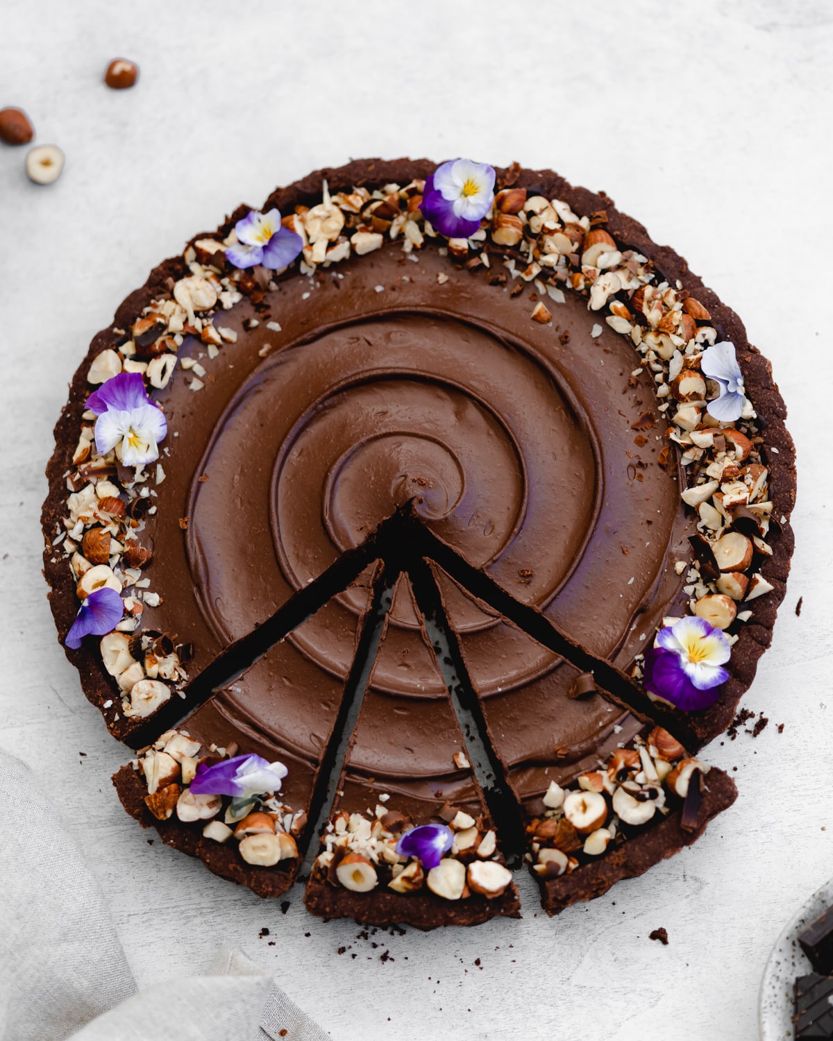 vegan chocolate tart with hazelnuts.