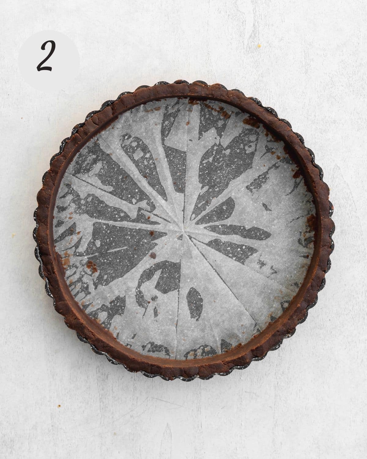 chocolate shortcrust pastry pressed into sides of tart tin.