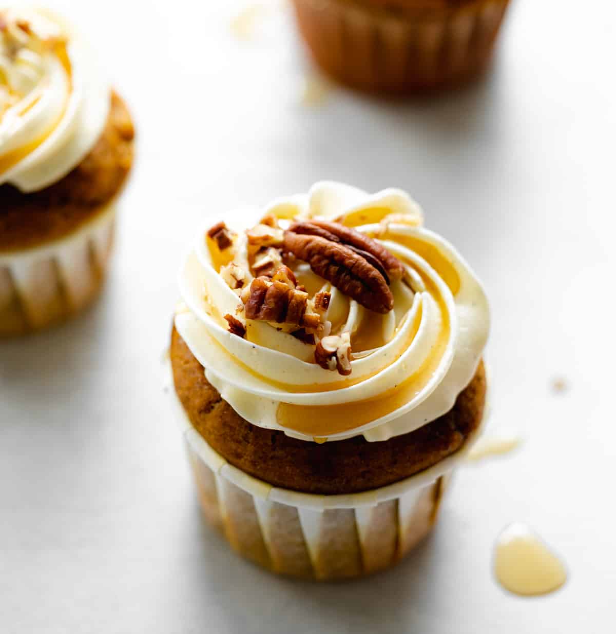 pumpkin cupcakes with cream cheese frosting.