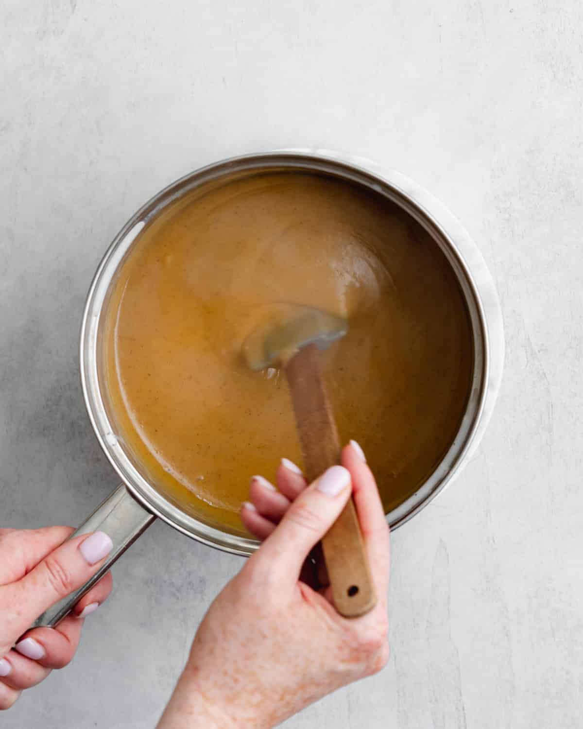 making pumpkin custard for pie.