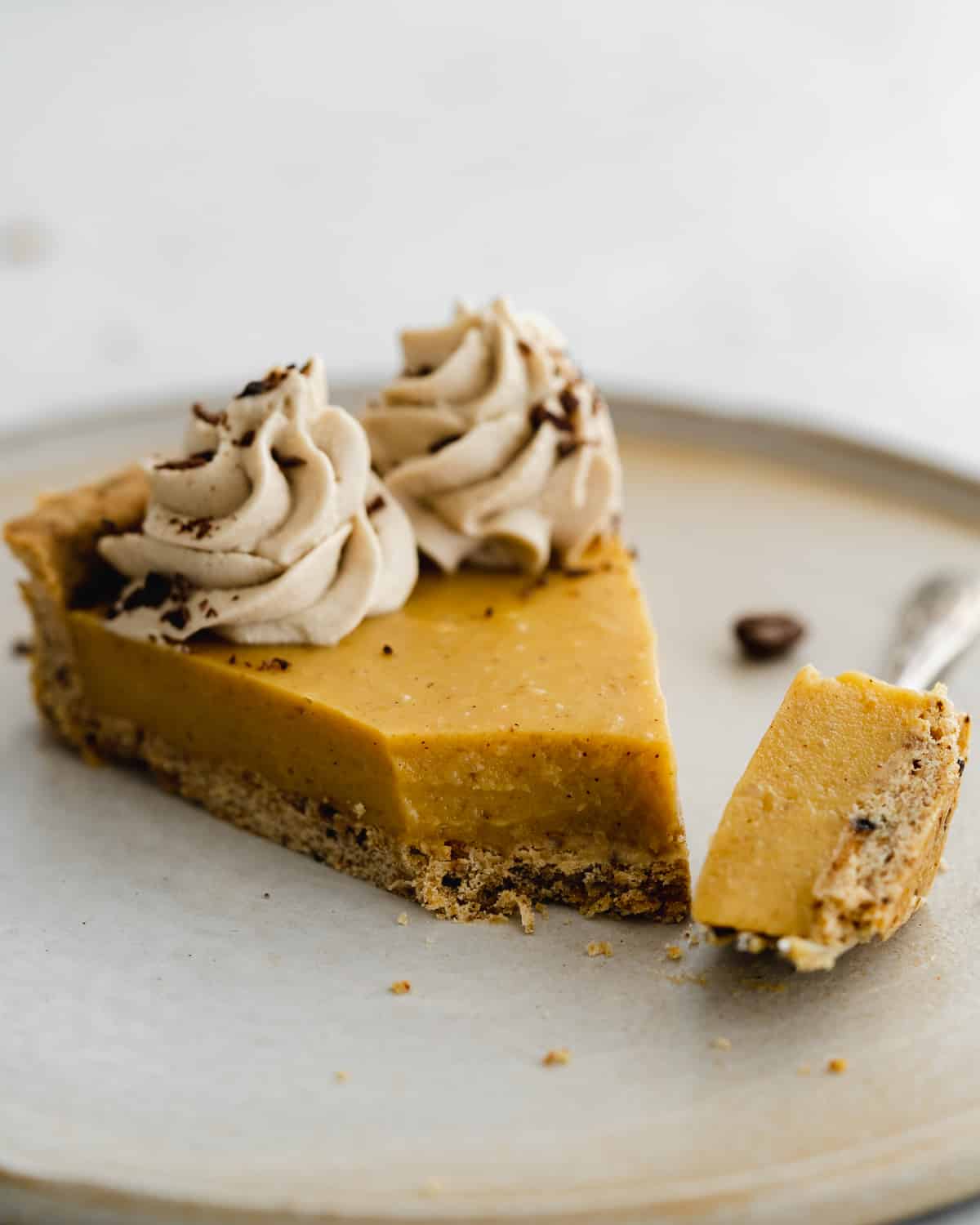 vegan pumpkin custard tart with pumpkin spice.