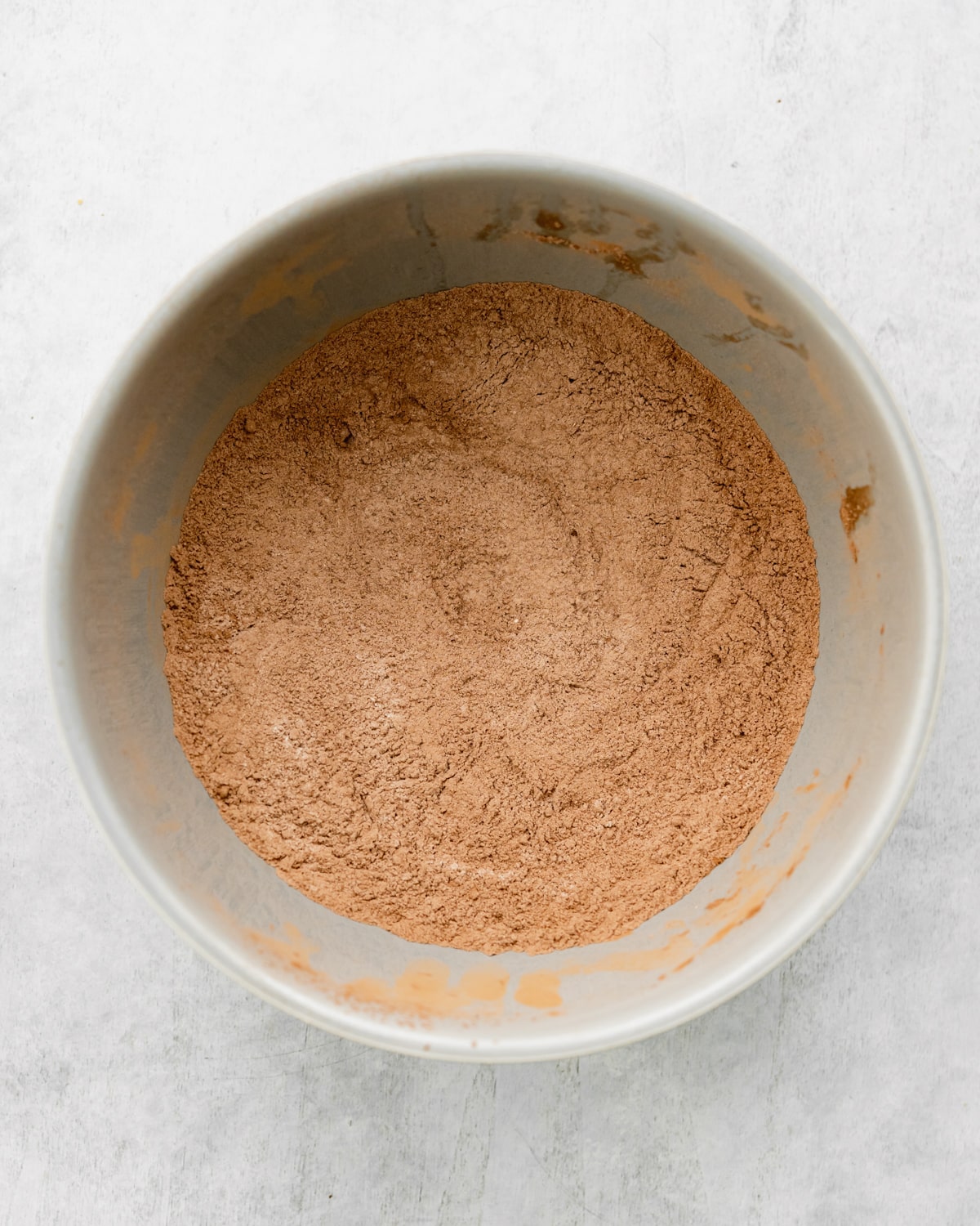 dry ingredients for black forest cupcakes in a grey bowl.
