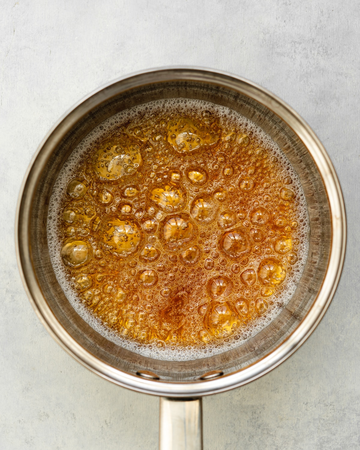 amber caramel in a saucepan.