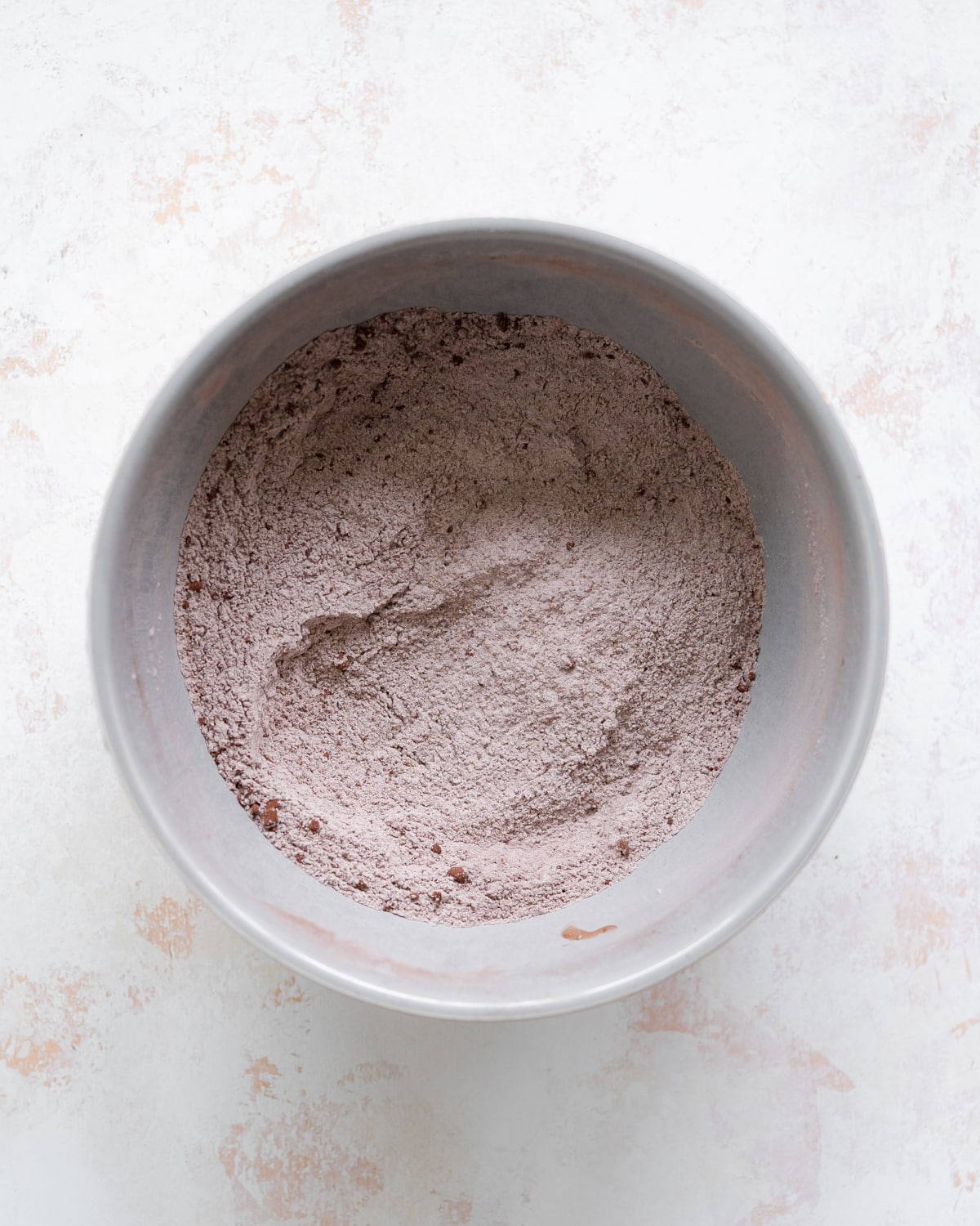 dry ingredients for chocolate cake in a bowl.