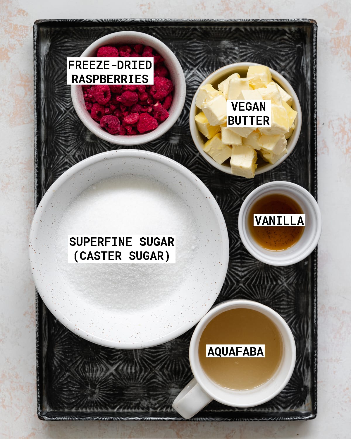 ingredients to make dairy free raspberry buttercream on a metal tray.