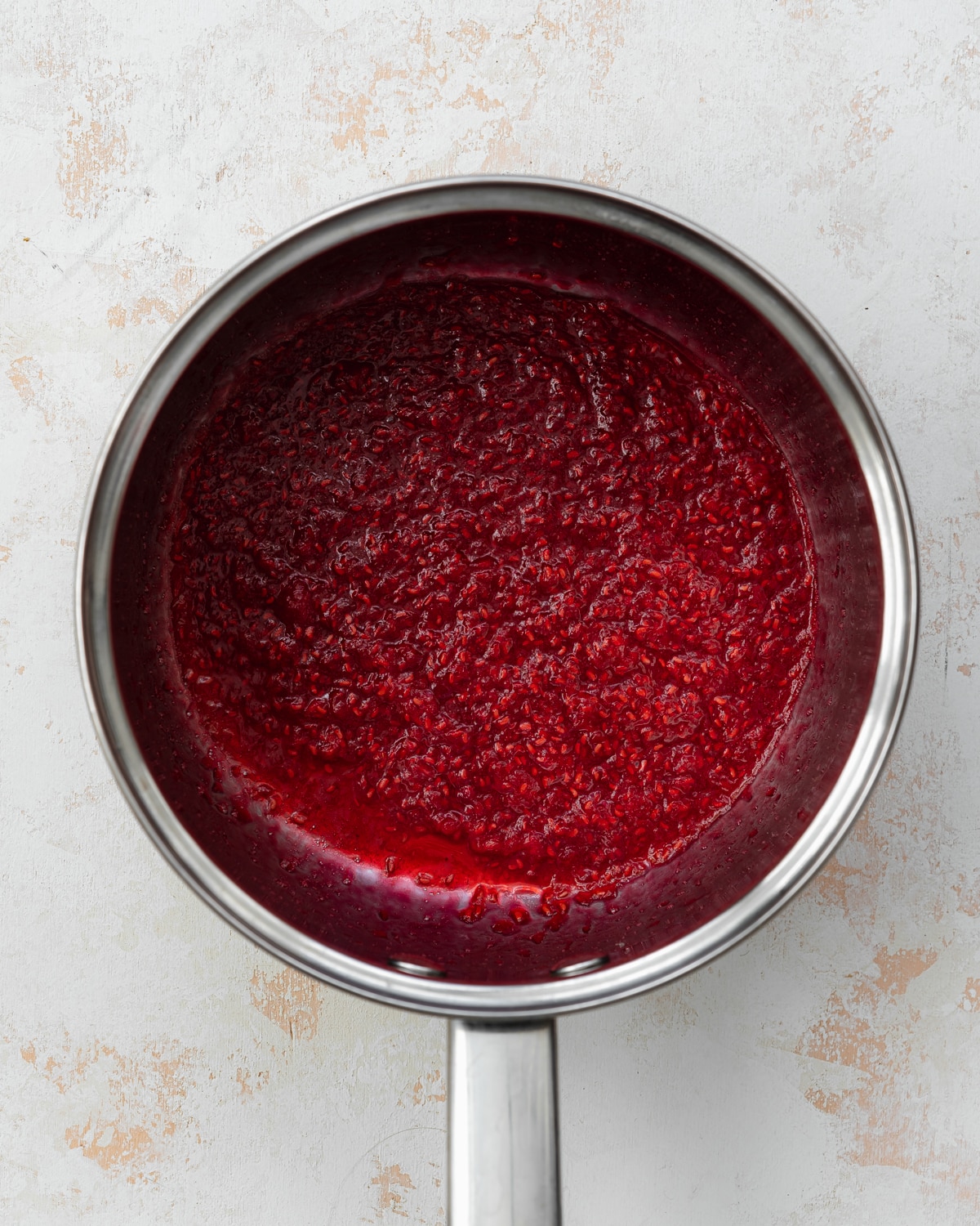 raspberry coulis in a saucepan.