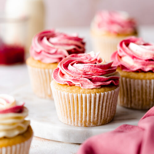 raspberry cupcakes with ombre pink buttercream and raspberry powder top top.