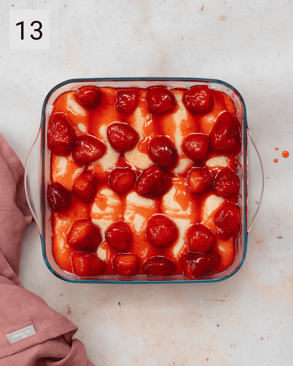 layering a strawberry tiramisu.