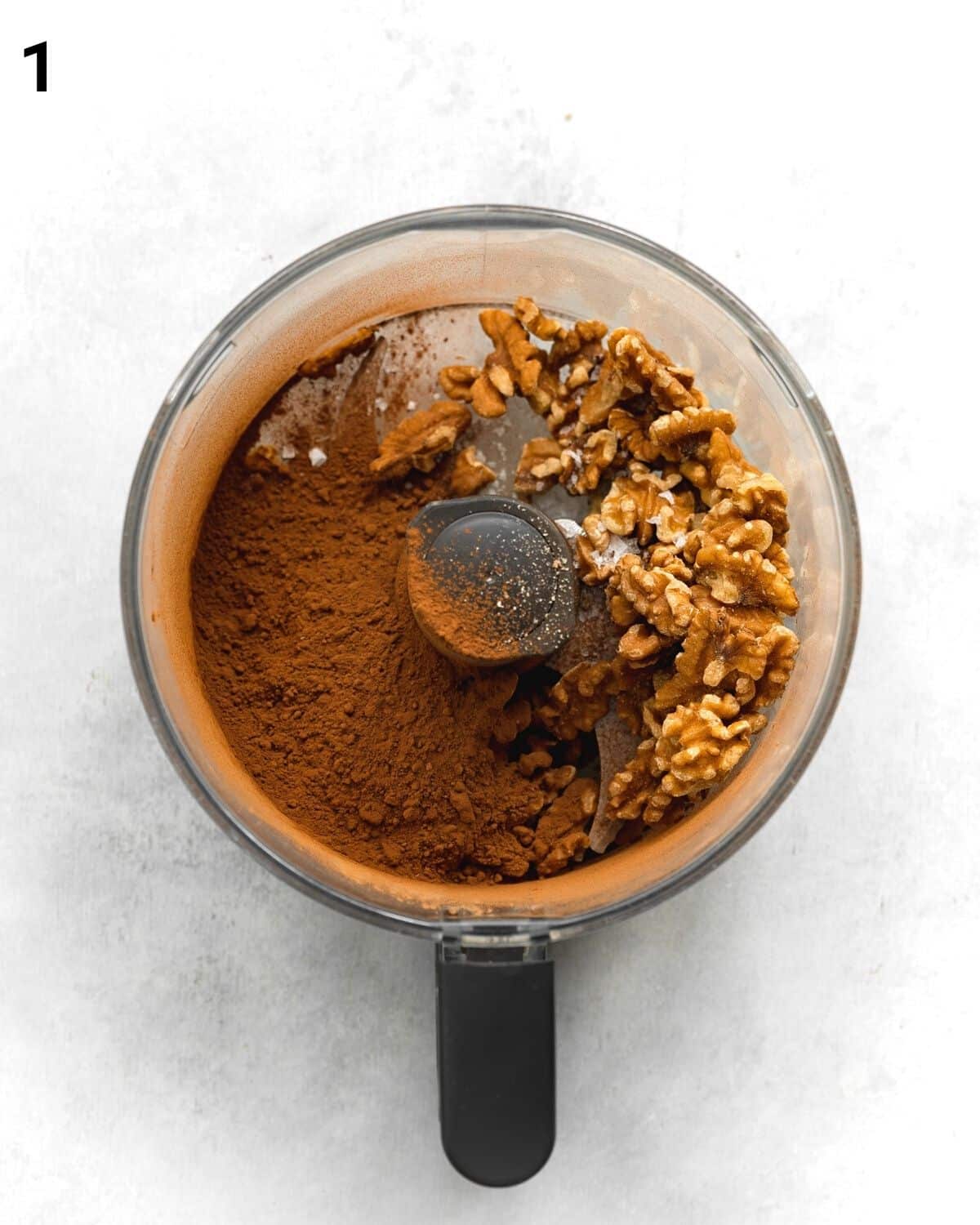 top down view of food processor filled with brownie ingredients.