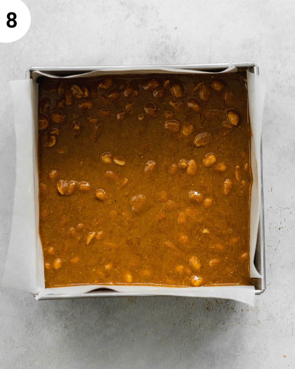 top down view of snickers brownies in a metal square pan.