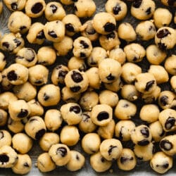 cookie dough balls on a baking tray.