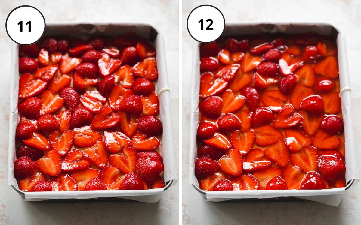 strawberry cheesecake in a rectangular cake pan lined with parchment paper.