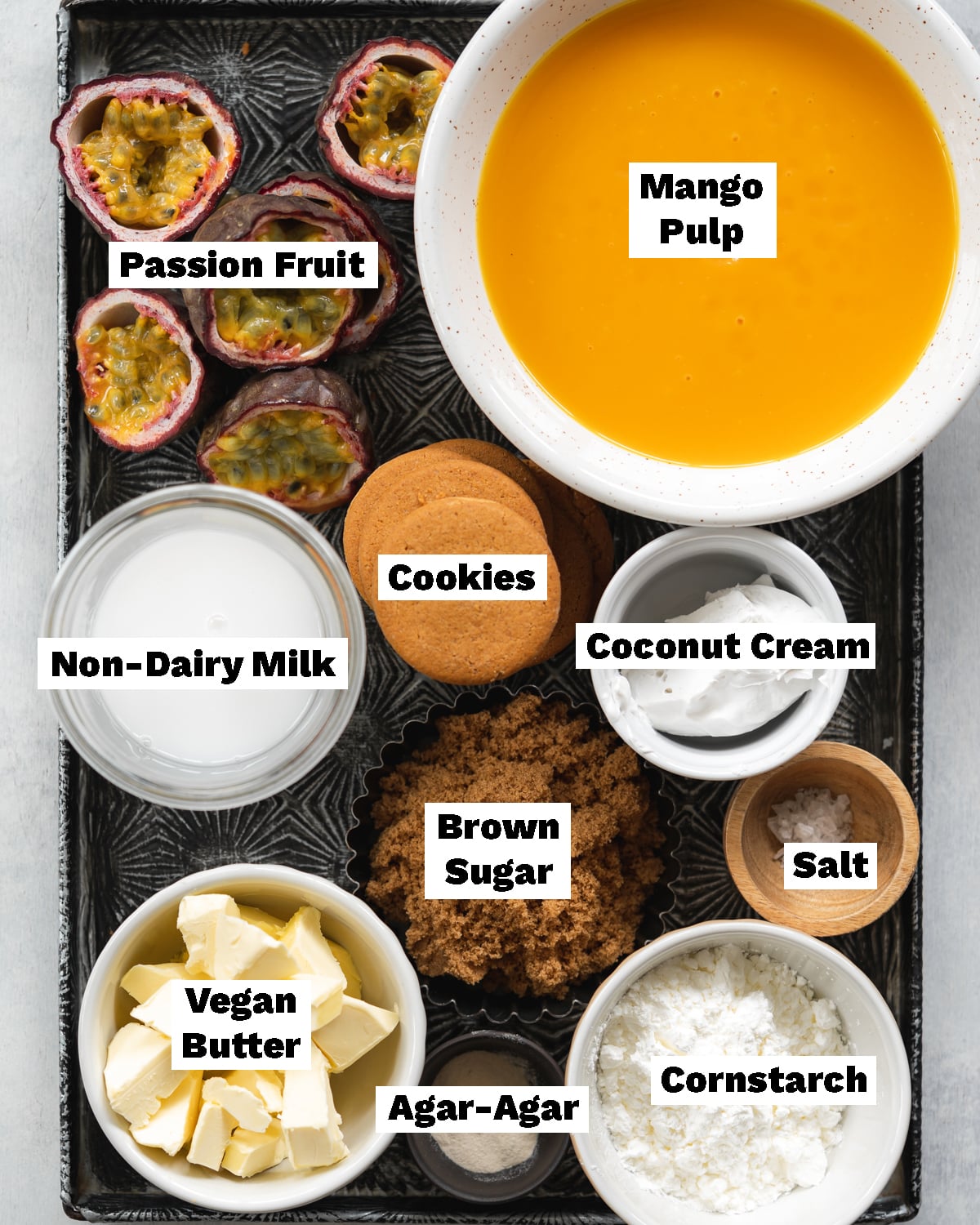 ingredients for vegan mango pie measured out on a metal tray.