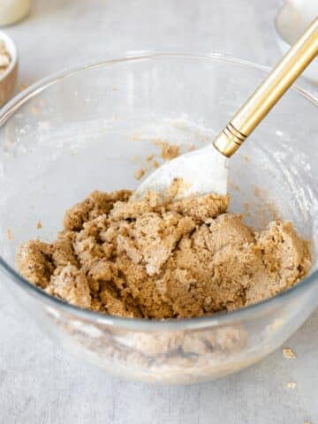 cinnamon cookie dough in a bowl with a rubber spatula.