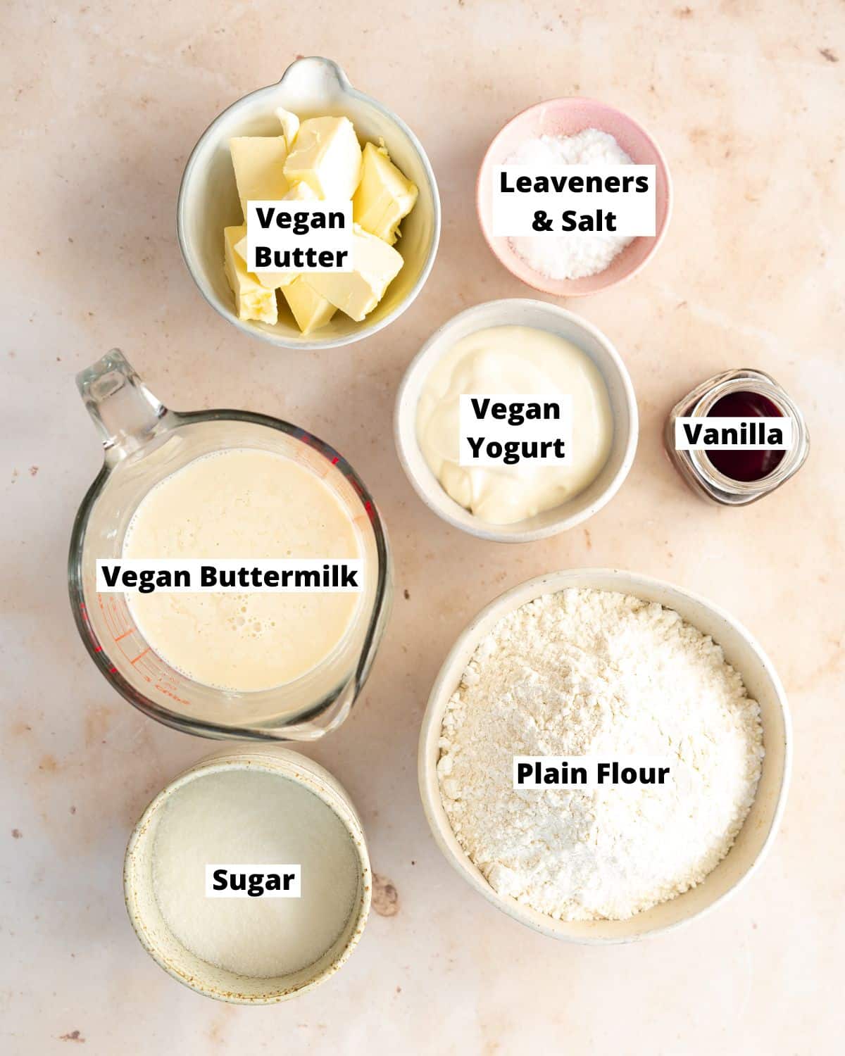 ingredients to make vegan cupcakes measured out in bowls.