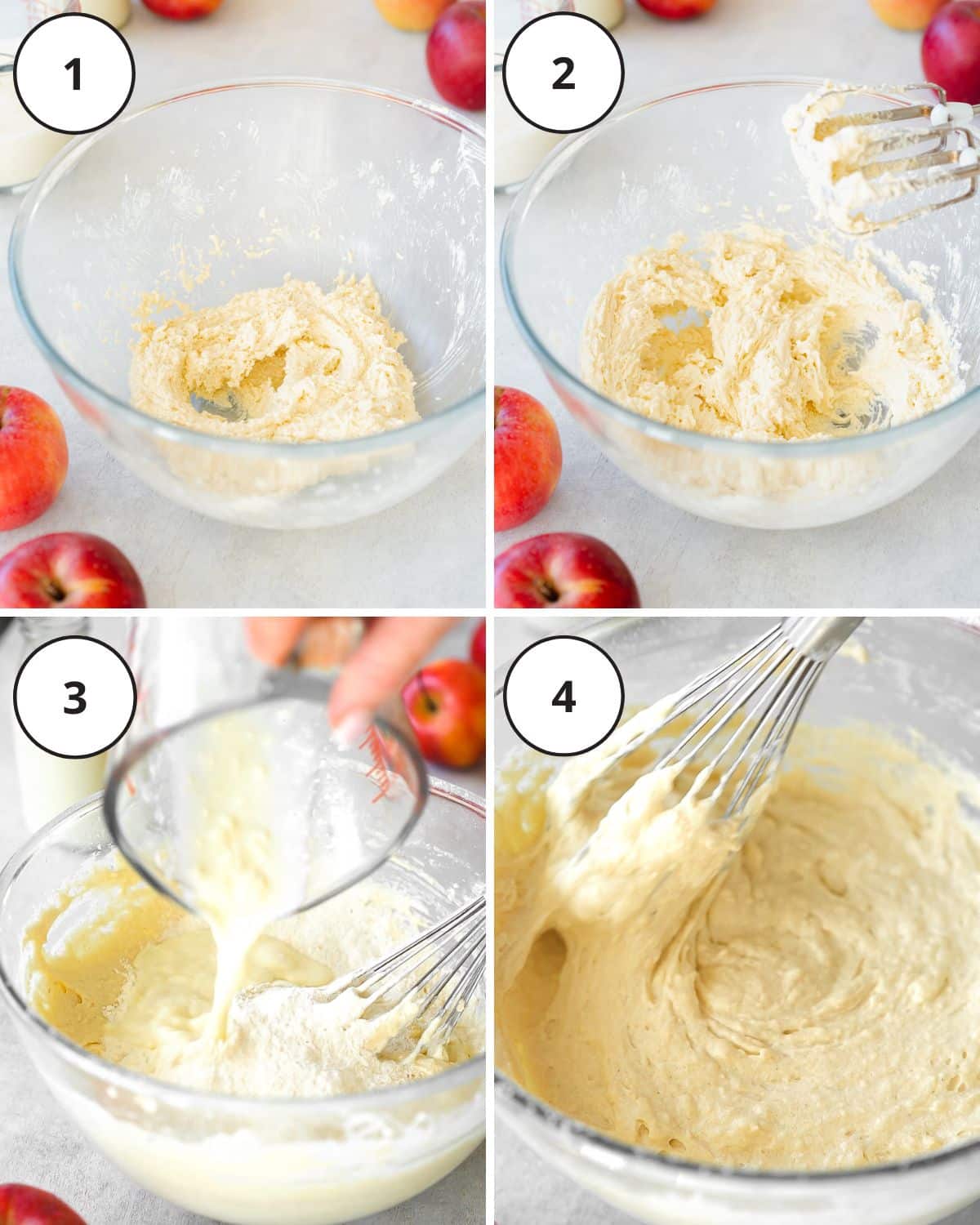 mixing cake batter in a clear bowl with a whisk, with red apples scattered around the bowl.