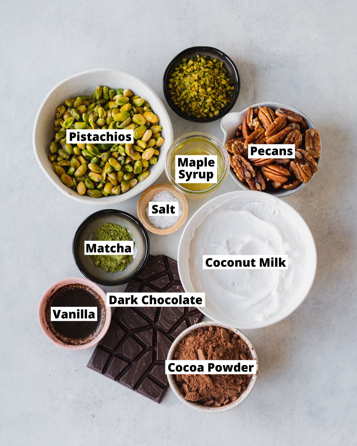 ingredients for chocolate pistachio tart measured out in bowls.