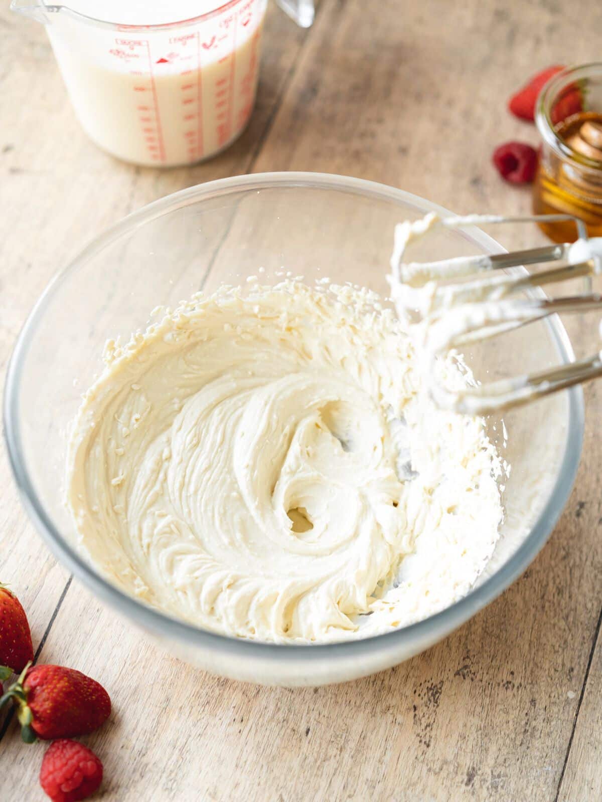 vegan mascarpone whipped to a creamy consistency in a mixing bowl.