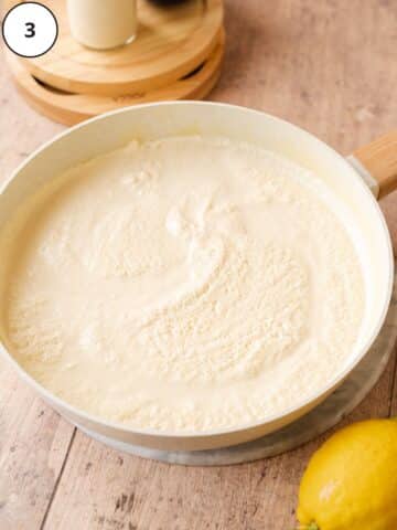 vegan ricotta in a saucepan showing curds separated from the soy milk.