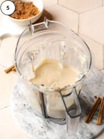Vegan cinnamon roll cheesecake filling after blitzing in a high-powered blender until smooth and creamy.