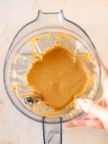roasted peanuts blended until smooth and creamy in a blender jug.