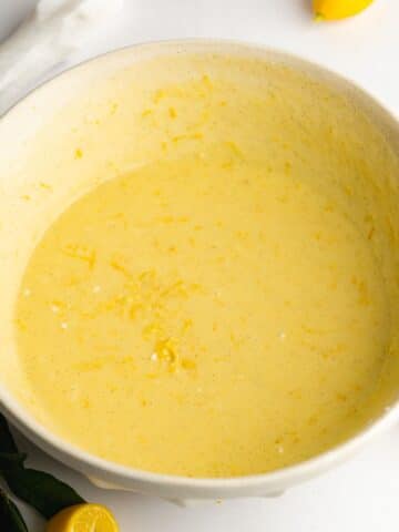 Olive oil and buttermilk is added to the sugar mixture and whisked together.