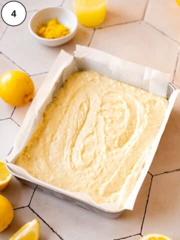 lemon cake batter in a baking tray ready to go into the oven.
