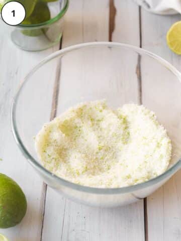 Lime zest and sugar rubbed together in a small mixing bowl.