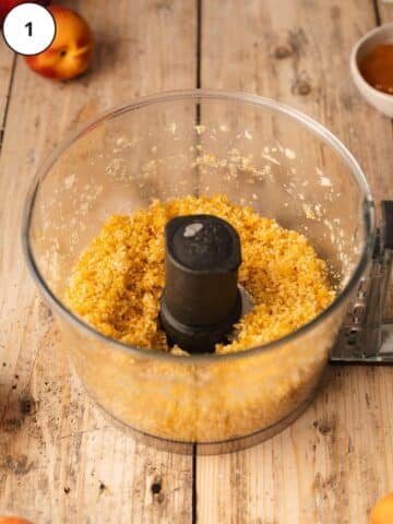 Press-in nut crust ingredients after pulsing together in a food processor until they look like wet sand.