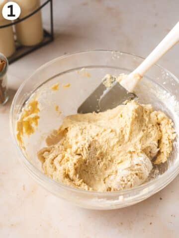 Vegan cinnamon bun dough after first mixing into a shaggy state.