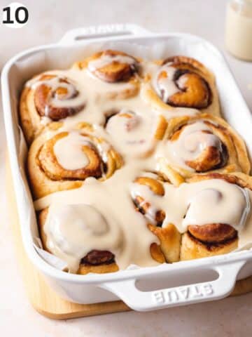 Baked, dairy-free and eggless cinnamon rolls in the baking dish to cool.
