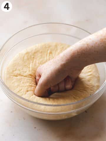 Punching the cinnamon bun dough down after the first rise.