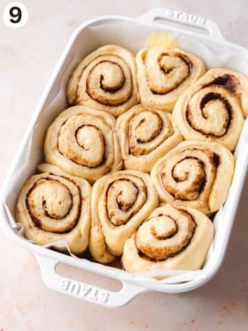 Vegan cinnamon buns after the second rise, they're all smooshed together and puffy before baking.