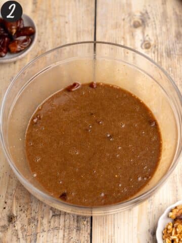 dates, coffee, olive oil, brown sugar, and vegan yogurt mixed together in a large mixing bowl.