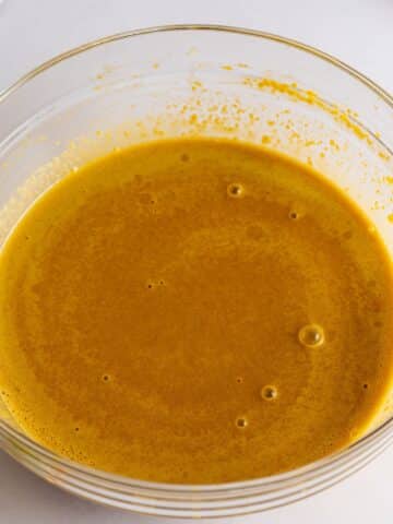 wet ingredients mixed together in a large mixing bowl.