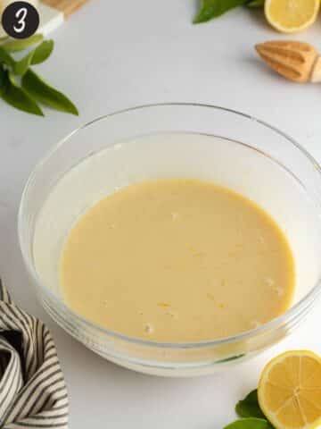 all the liquid ingredients for lemon muffins in a mixing bowl.