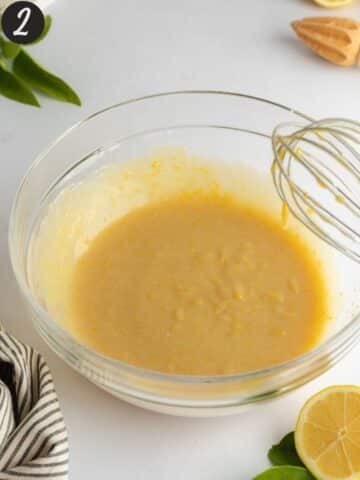 sugar, yogurt, olive oil, vanilla, and lemon zest whisked to a paste in a mixing bowl.