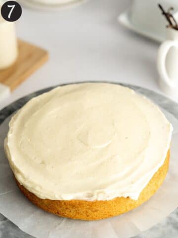 one cake layer frosted with an even layer of buttercream.