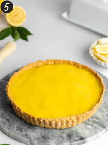 shortcrust pastry tart topped with lemon curd.