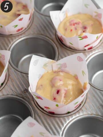 raspberry tulip muffin liners filled with muffin batter before baking.